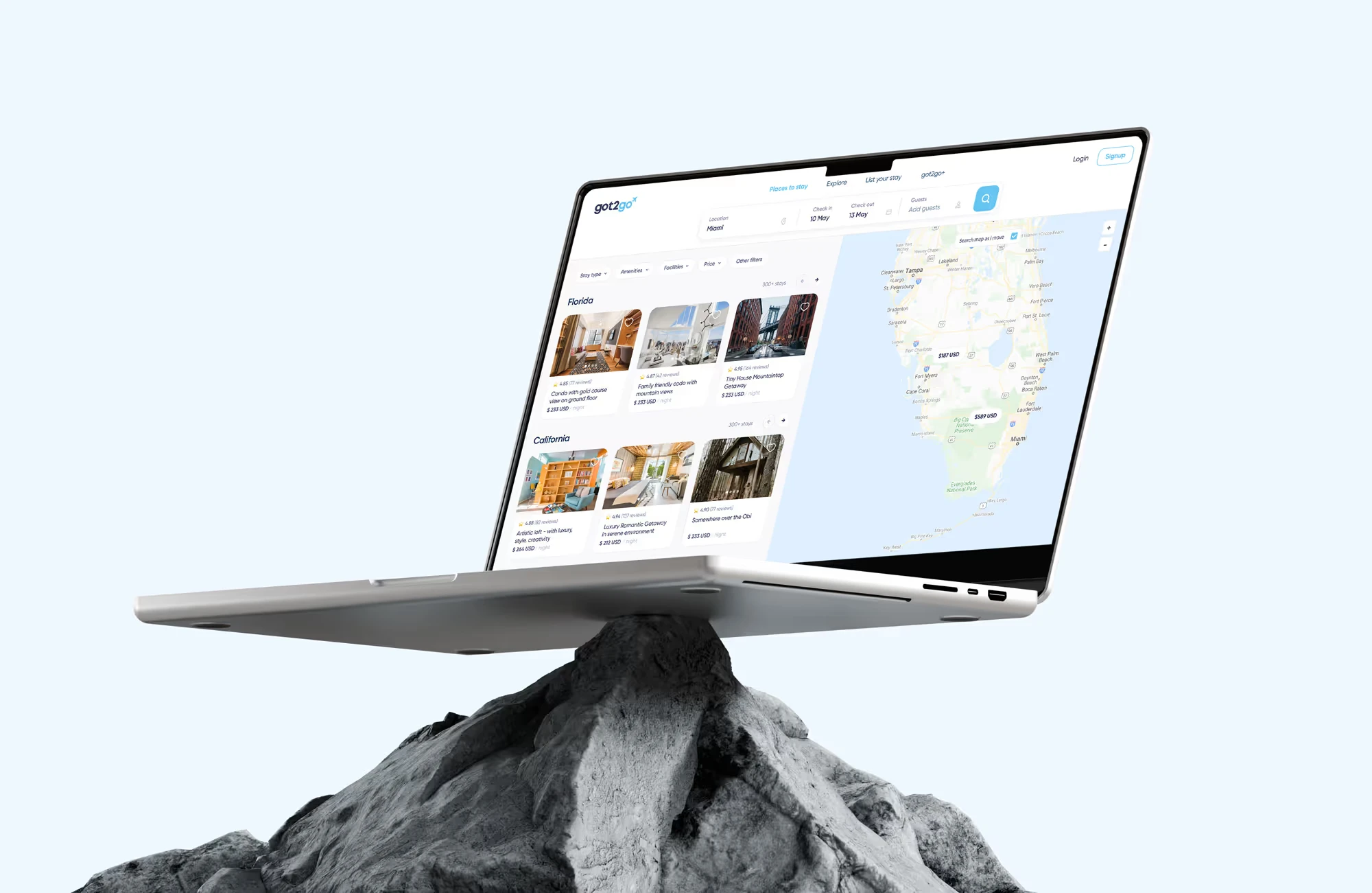 got2go stay search with listings by region beside a map of Florida, on a laptop balanced on a rock